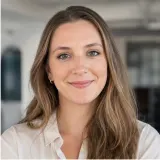 AI-generated realistic representative portrait for Michaela review card
